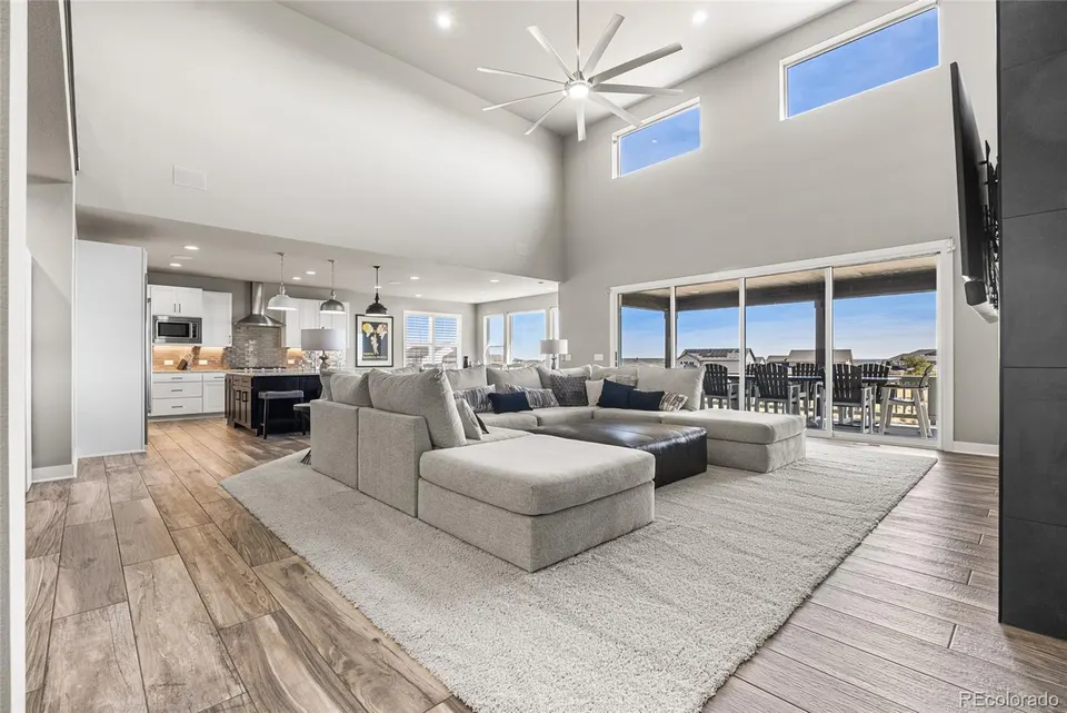 Great room with two-story ceiling, hardwood floors and clerestory windows