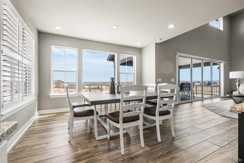 Dining area with plantation shutters and views