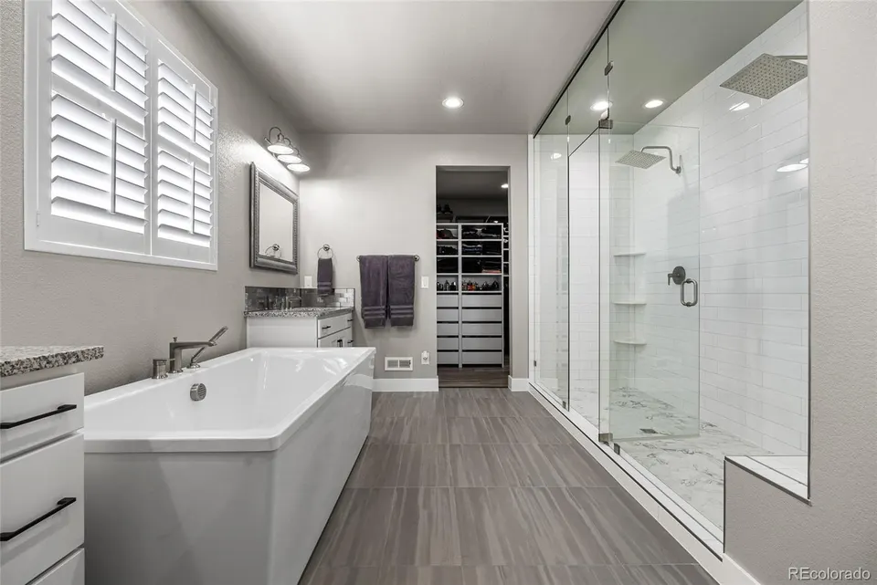 Primary bath glass shower and soaking tub