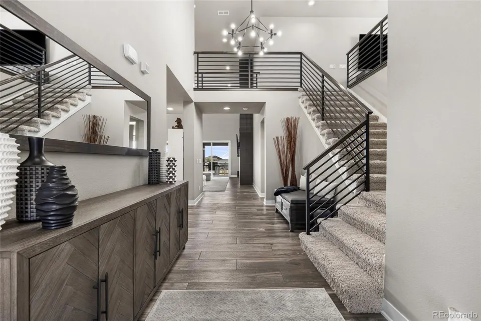 Entry hall and open staircase with horizontal railing