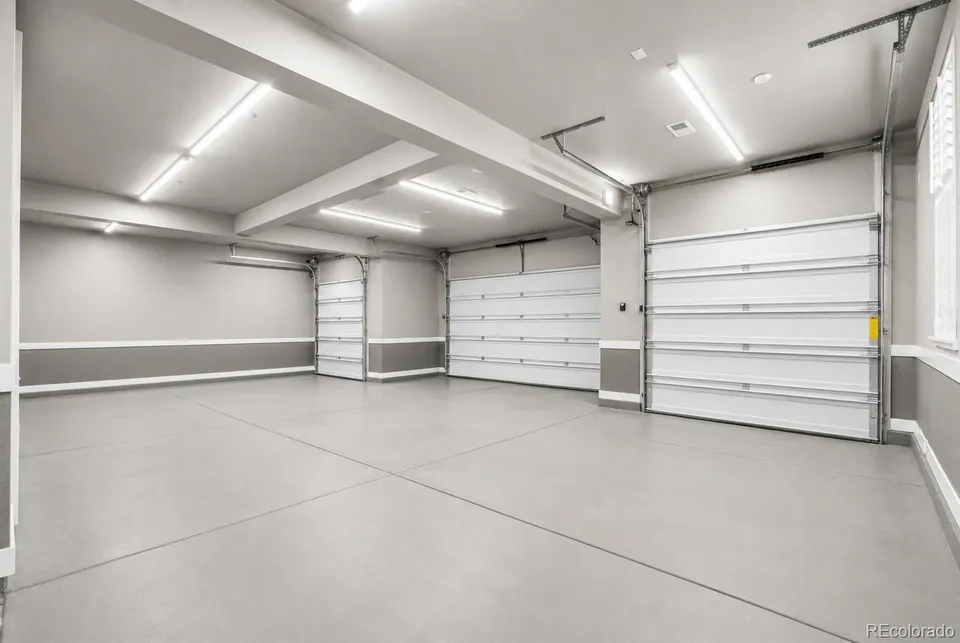 Oversized four-car garage with epoxy floor