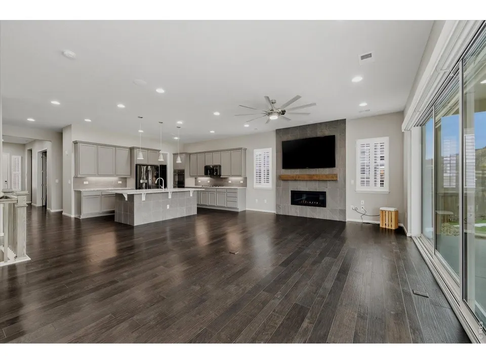 Great room with linear fireplace and 20-foot glass slider