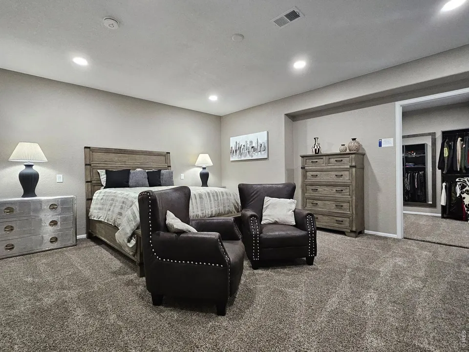 Lower-level bedroom with sitting area