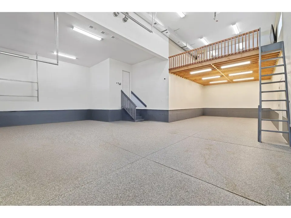 Climate-controlled garage with epoxy floor and custom loft