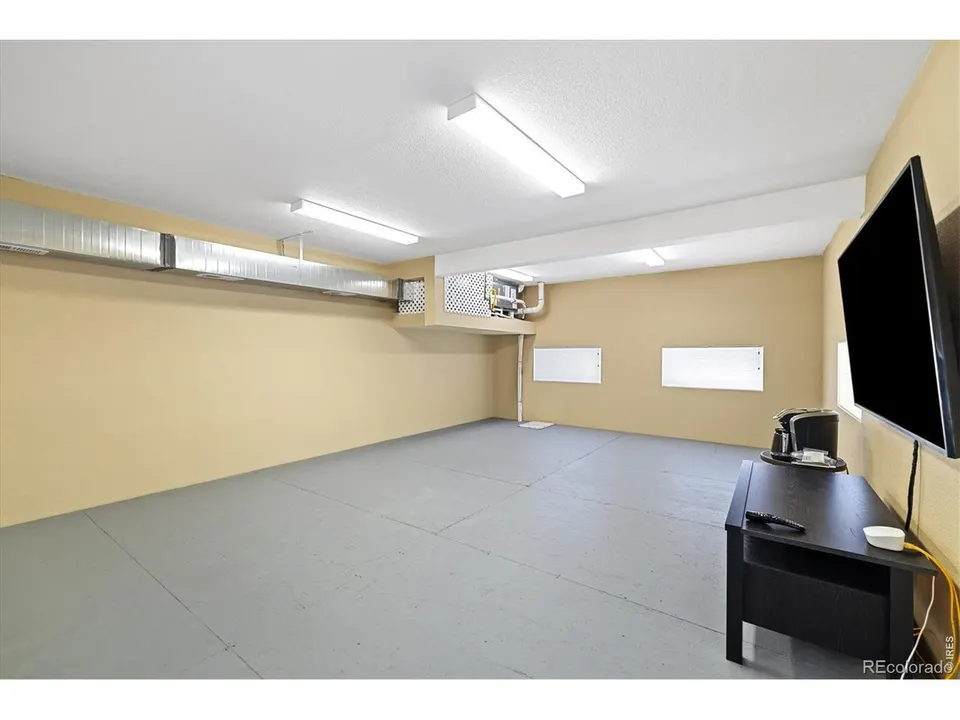 Garage recreation space with television