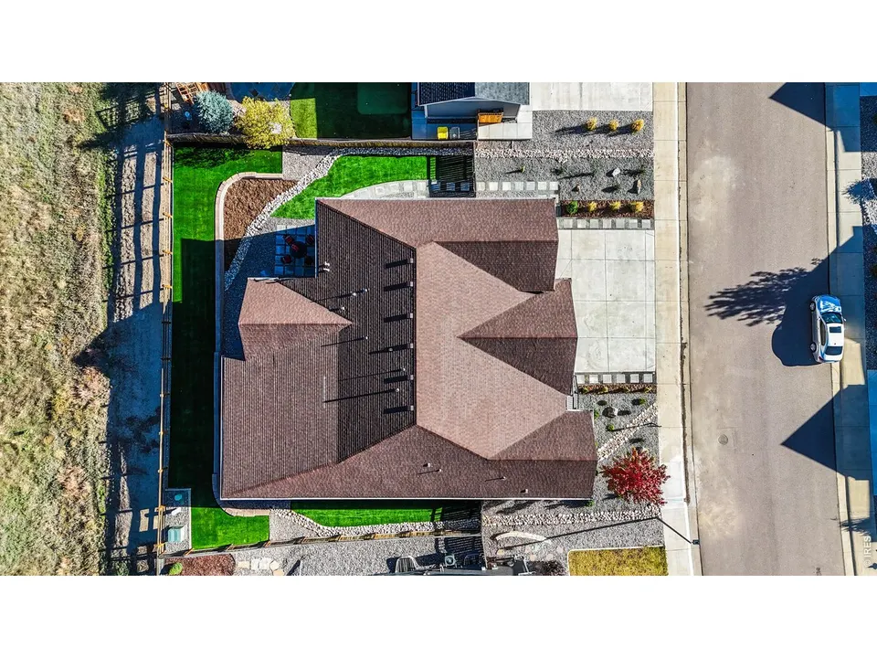 Aerial view of the home and lot backing to open space